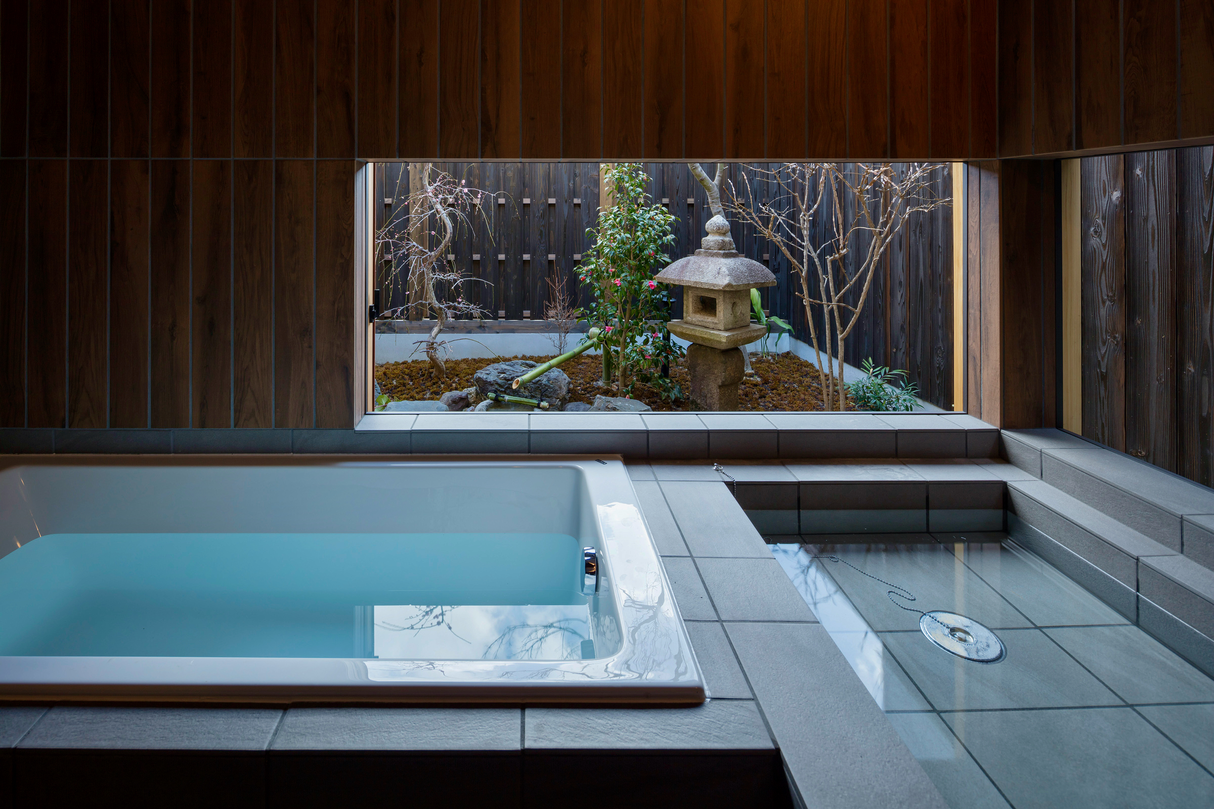 Bath with a view of the garden in a traditional Japanese house