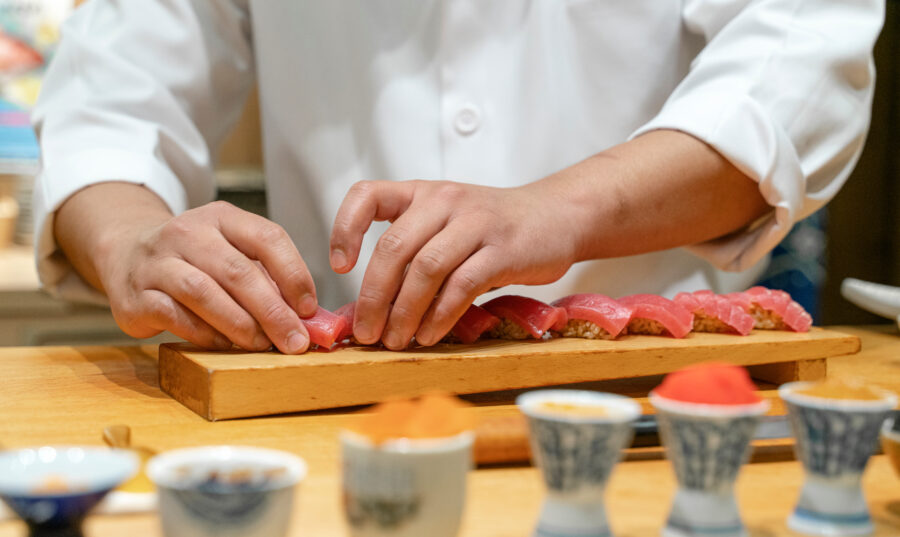 Japanese Sushi Chef making Bluefin Tuna Sushi. Omakase sushi course.