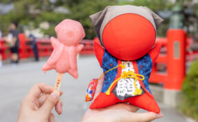 Red Sarubobo Dolls and Ice Cream at Miyagawa Morning Market in Takayama, Japan.