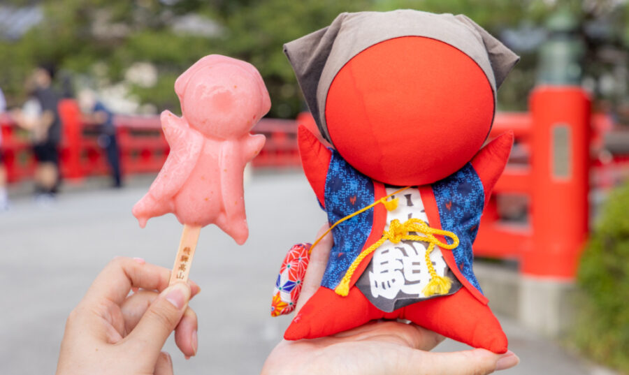Red Sarubobo Dolls and Ice Cream at Miyagawa Morning Market in Takayama, Japan.