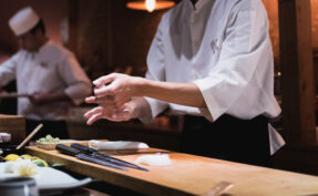 Chef preparing sushi, squeezing rice, fast motion in hands. Omakase style Japanese traditional.