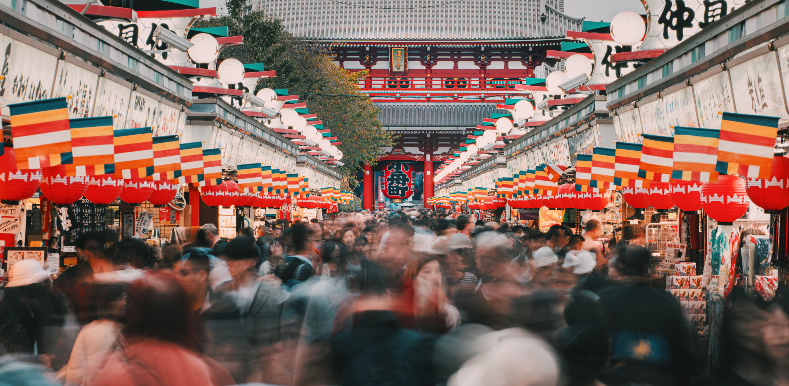 Crowd of people walking on Nakamise Dori street of the Asakusa Kaminarimon in Tokyo, Japan